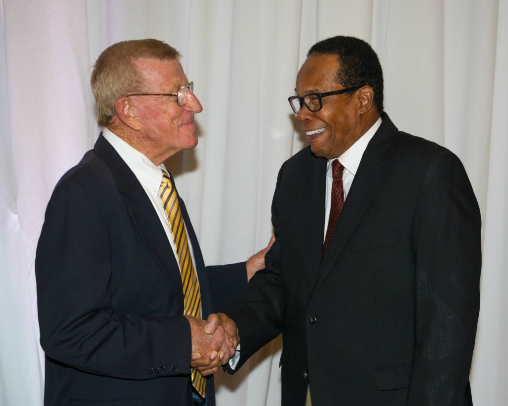 Hall-of-Fame Notre Dame coach Lou Holtz greets retired MLB player, Rod Carew during Servite's 8th Annual Excellence in Leadership Dinner.